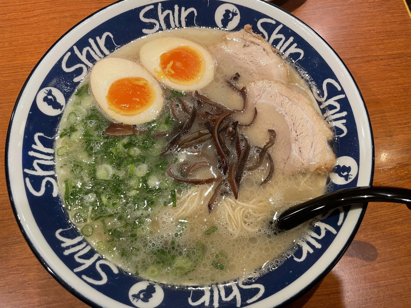 A bowl of Hakata tonkotsu ramen with chashu and a soft-boiled egg