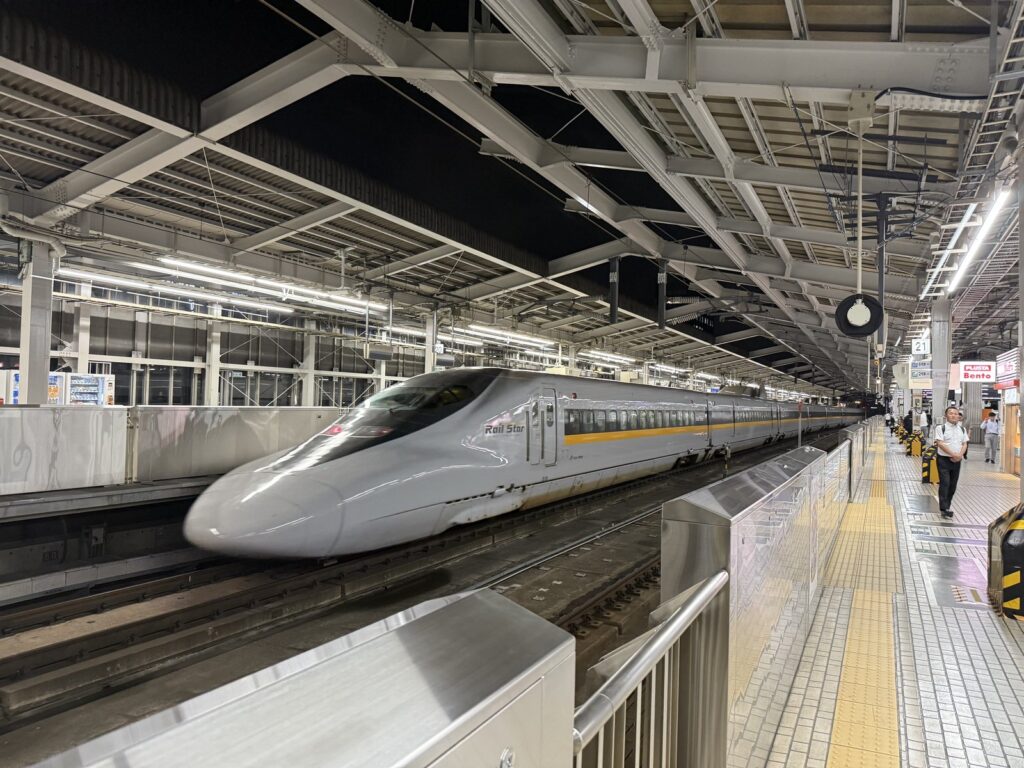A Shinkansen bullet train at a Japanese station platform