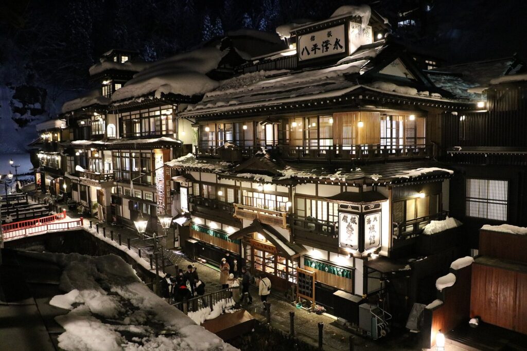 Evening twilight Ginzan Onsen town seen from the guest room of Kosekiya Bekkan