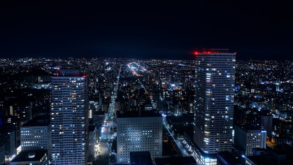 New Chitose Airport to Sapporo: Train, Bus or Taxi (2026) Night cityscape from JR Tower (north side)