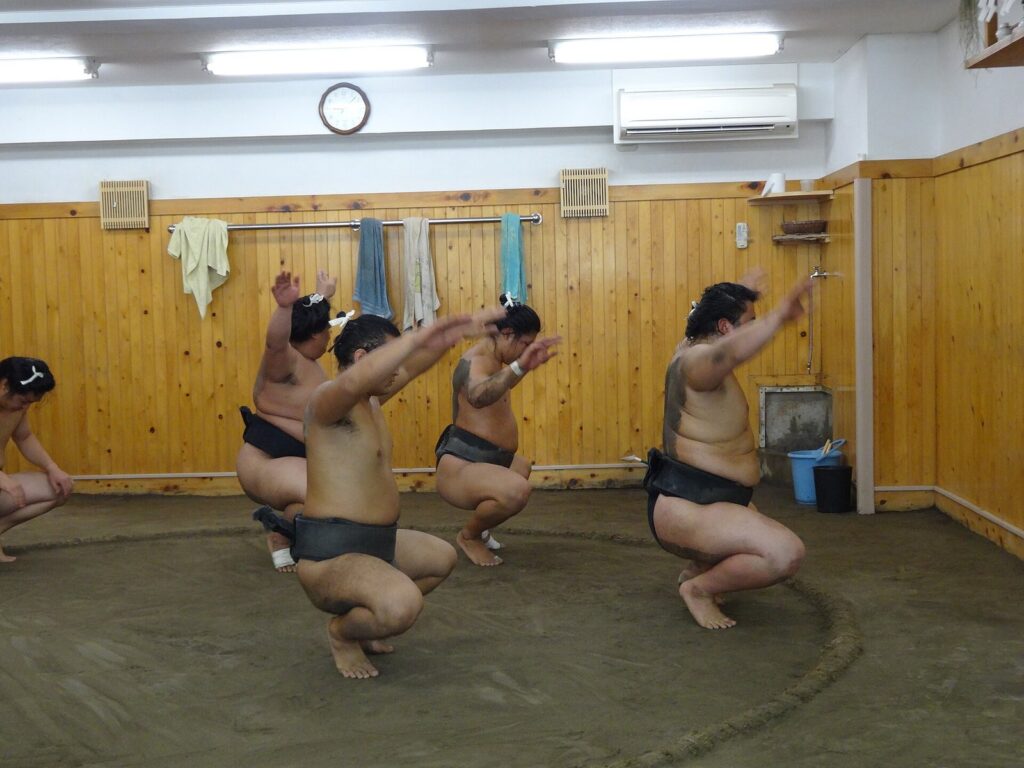 Sumo squats training at Arashio Stable Tokyo Japan (14657643137)